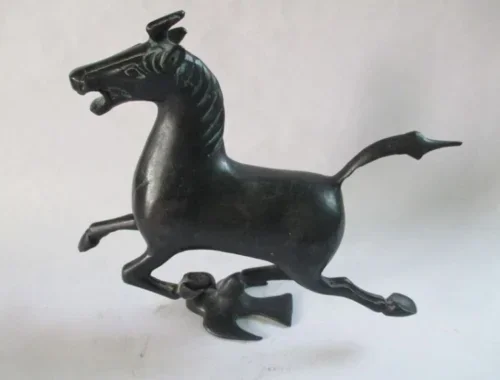 Ancient Chinese bronze statue. The horse stepped the swallow