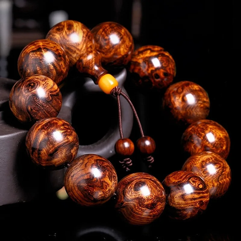 

Hainan Huanghua Pear Eyes And Ghost Faces Facing Old Material Tumor Scars Men s Wooden Bracelet With Buddha Beads Wooden jewelr