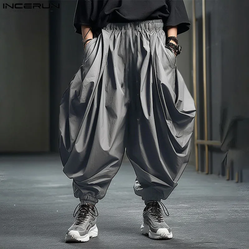 

INCERUN Men Irregular Pants Solid Color Elastic Waist Joggers Loose Trousers Men Streetwear 2026 Drop-crotch Casual Harem Pants