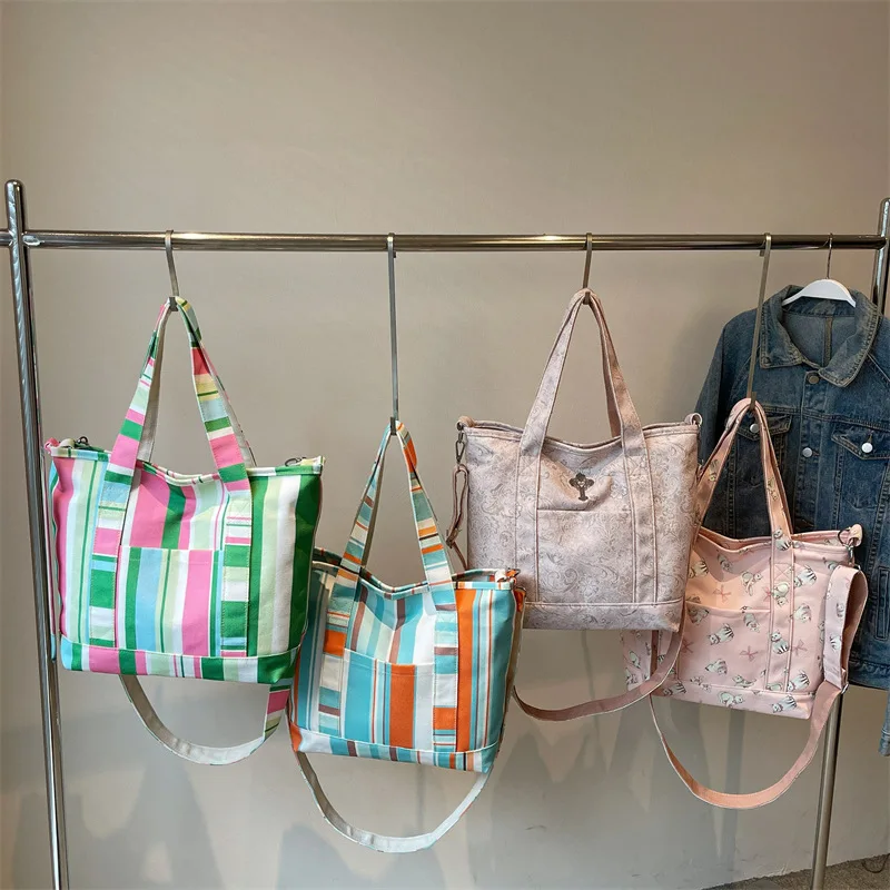 Striped color-blocking single-shoulder bag, hand-held canvas bag, student shopping and commuting crossbody bag