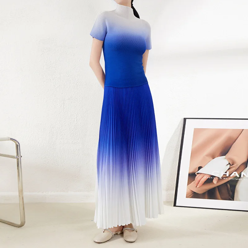 Gradient pleated fashion two-piece set for women, featuring a fitted top and pleated skirt, perfect for summer. High-waisted.