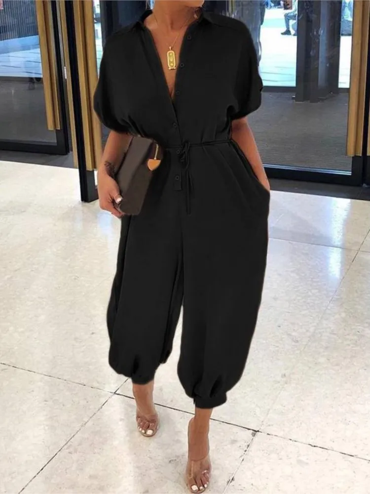 Letnia moda z dekoltem w kształcie litery V, zapinana na guziki, sznurowana kombinezon z krótkim rękawem, luźna kombinezon Playsuit kobiety eleganckie pajacyki z kieszeniami w panterkę