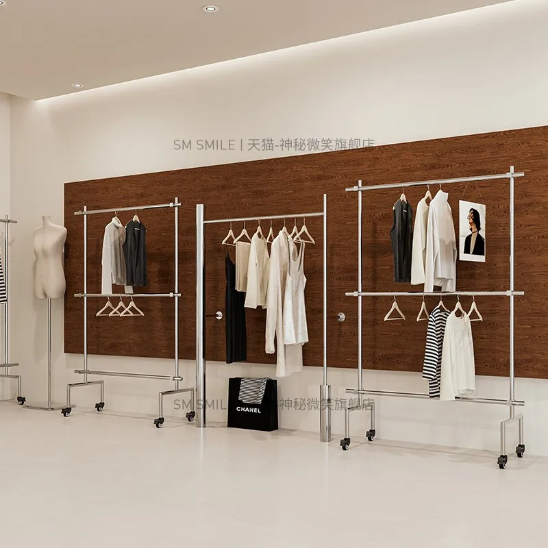 

Clothing store display rack on the wall Stainless steel large tube hanger antique women's clothing store simple side hanging dis
