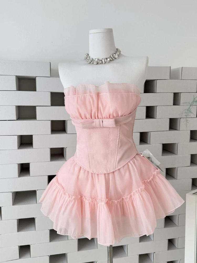 

Французский элегантный комплект из двух предметов для женщин: топ без бретелек с рюшами и бантом + короткая пышная юбка из сетки с высокой талией