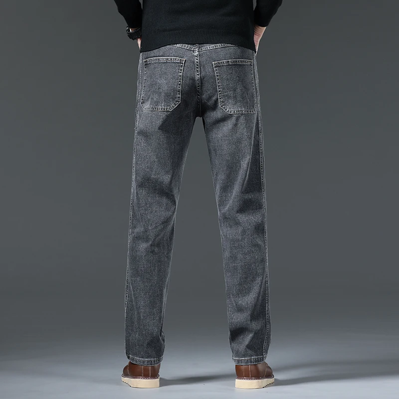 Abbigliamento classico da uomo Jeans larghi autunno nuovi pantaloni Casual da lavoro in tinta unita pantaloni in Denim moda uomo di marca