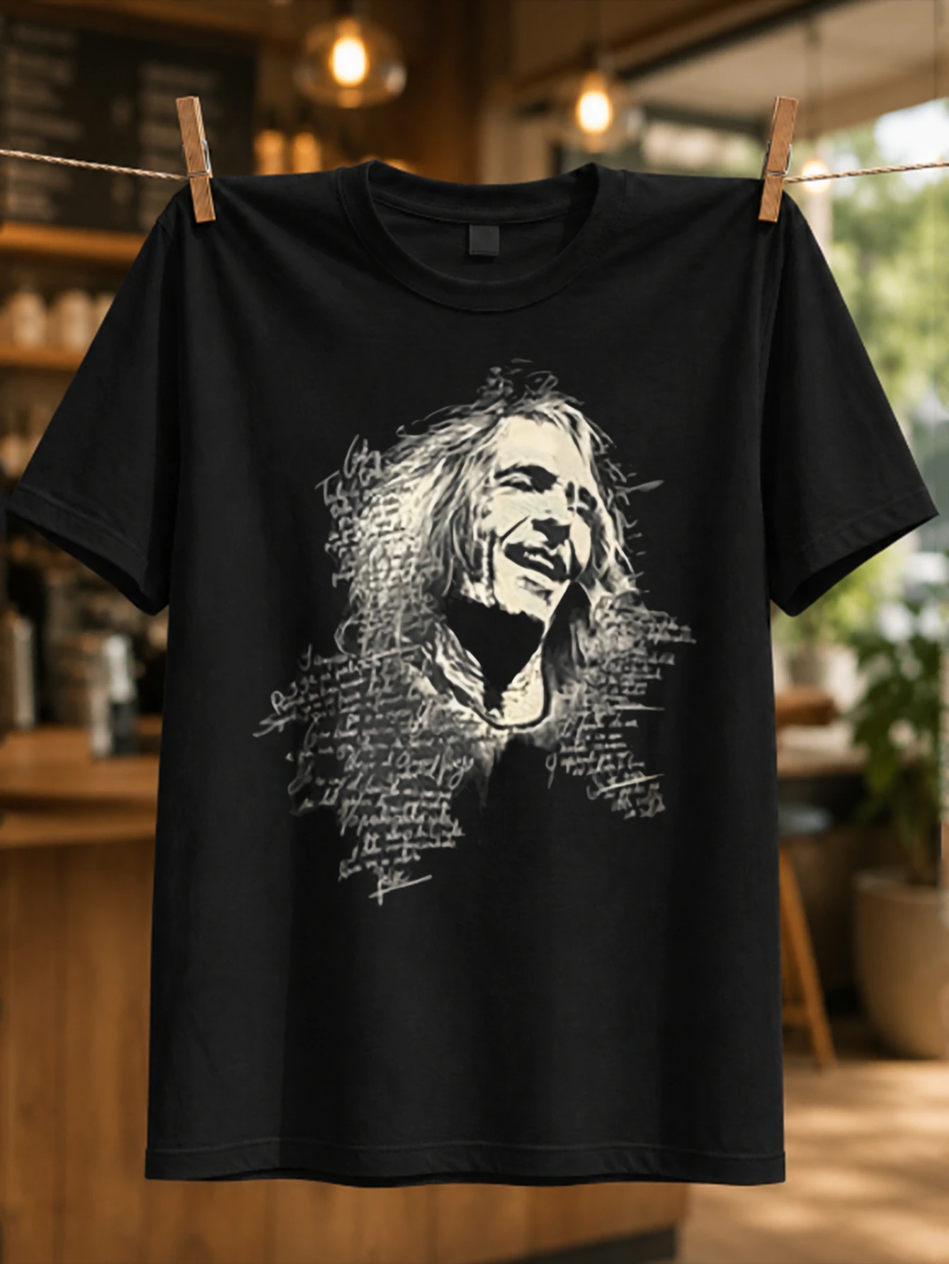Robe monochrome singer portrait built from rough text strokes and expressive face shading Spanish  Unisex All T-Shirt
