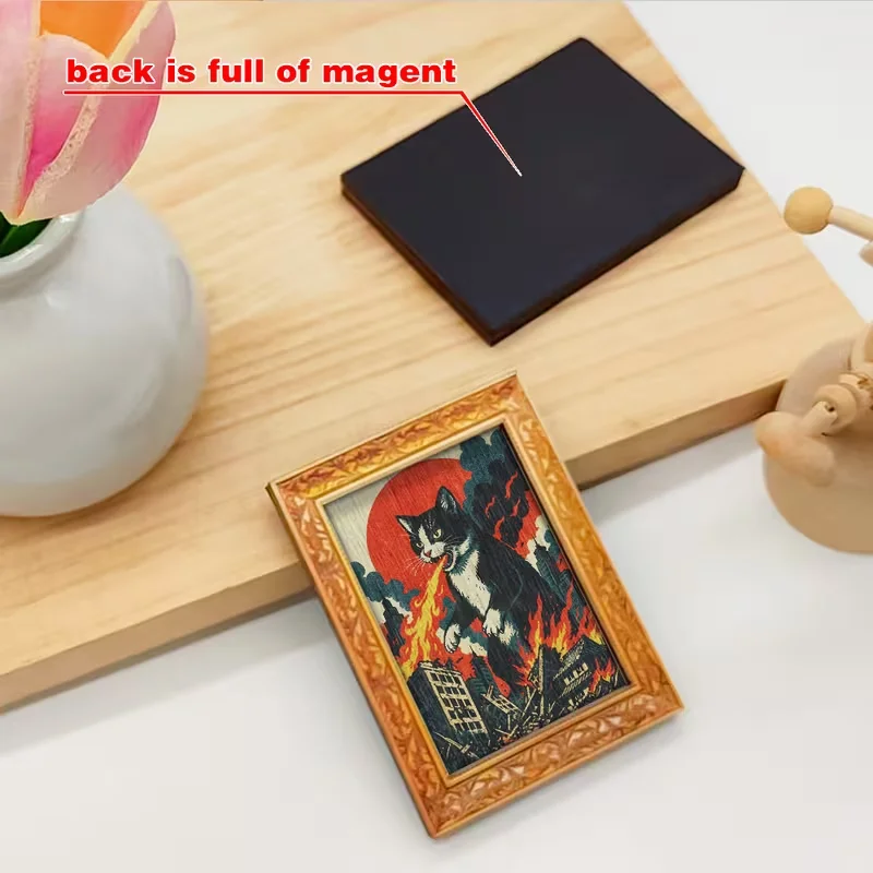 A giant cat attacks a magnetic poster depicting a wooden refrigerator, with a black and white cat emitting flames.