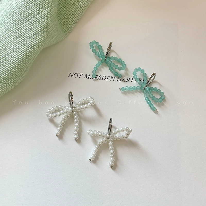 Pearl Bow Crystal Earrings - Sweet and Playful, Perfect for a Chic and Unique Vacation Look.