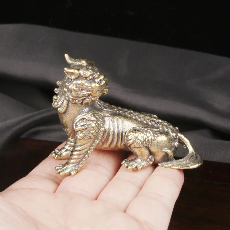 CH The brass divine beast listening ornament is a bronze sculpture of the mount of Ksitigarbha Bodhisattva the auspicious beast