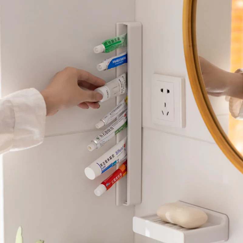 

Wall-mounted Toothpaste Dispenser Household Self-adhesive Tooth Paste Storage Rack Bathroom Accessories Save Space