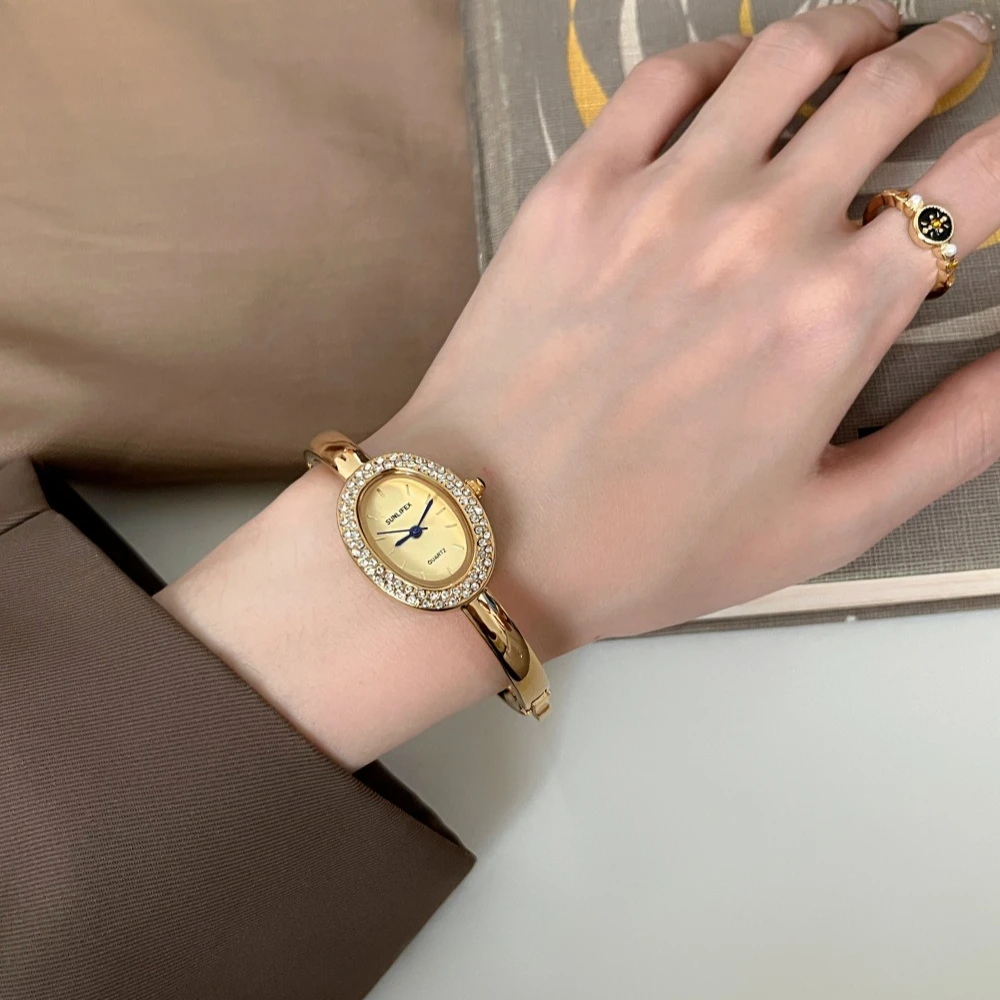 

Новые популярные женские часы в стиле ванны, розовое золото, бриллиантовый комплект, нишевый дизайн, простые легкие роскошные высококачественные овальные часы-браслет