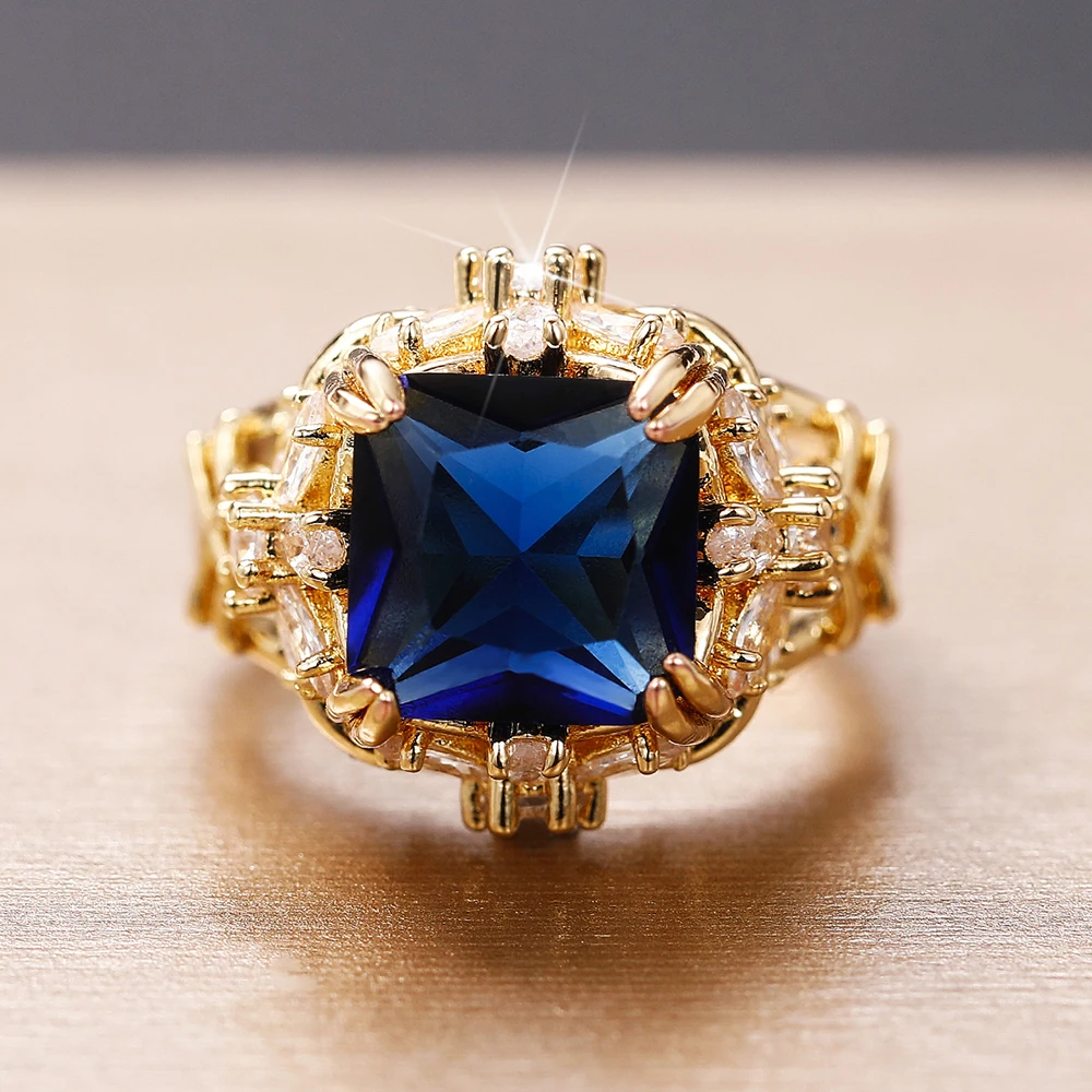 Huitan ästhetische Blume Design Frauen Eheringe Luxus 4 Krallen blau Zirkonia Verlobung zeremonie Party Braut schmuck