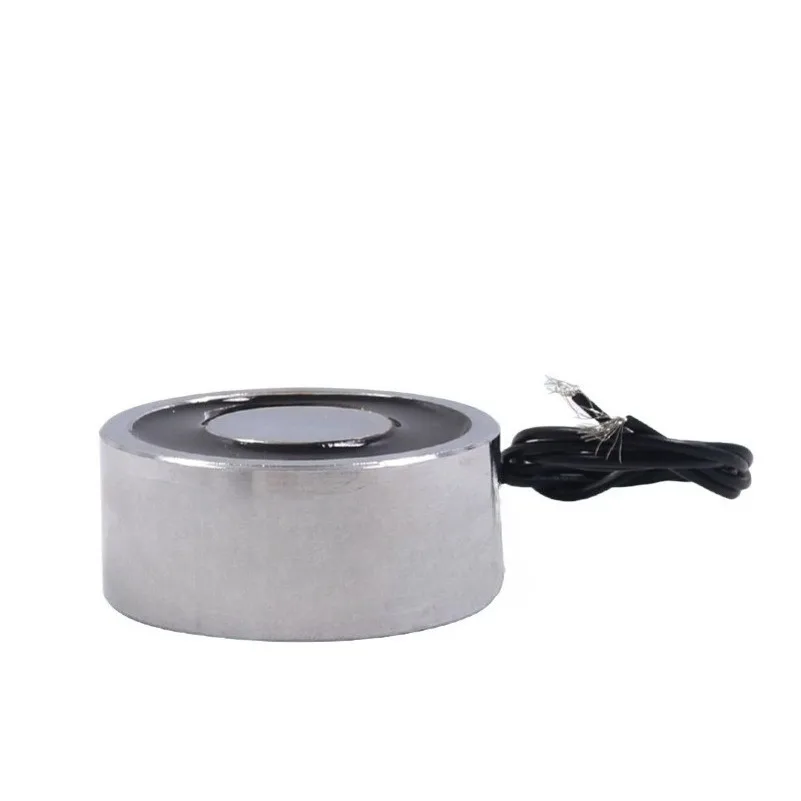 Small circular electromagnetic chuck generates magnetic force when powered, electromagnetic iron