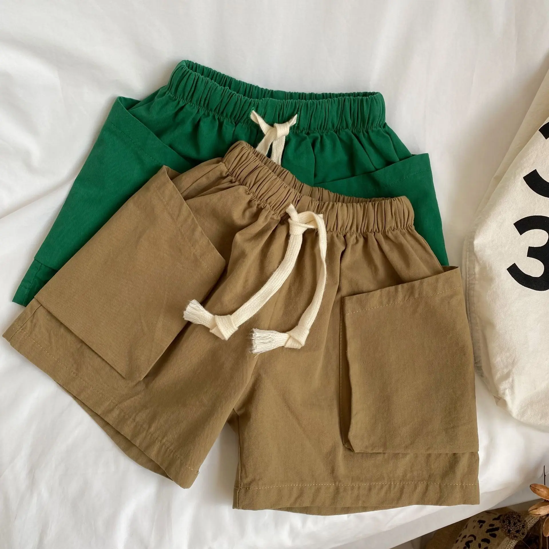 2025-verao-novo-produto-shorts-de-algodao-para-meninos-e-meninas-elegante-e-casual-edicao-coreana-bolso-padrao-diagonal-3d