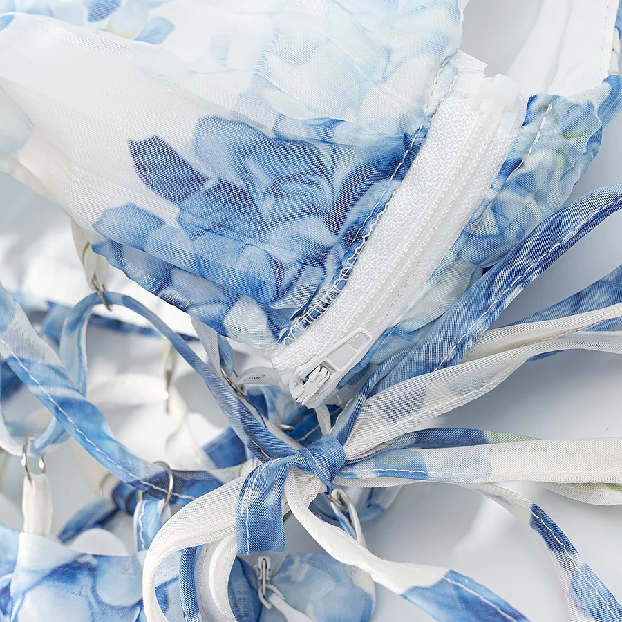 セクシーな青と白の花柄プリントミニワンショルダードレス、女性用クロスレースアップ包帯ボウホローアウトウエストスイングノースリーブドレス