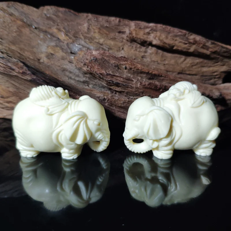 

Ivory Nut Carved Mini Auspicious Patterns Lucky Elephant Pair5.5*4.5*3cmHome Car Crafts Ornaments