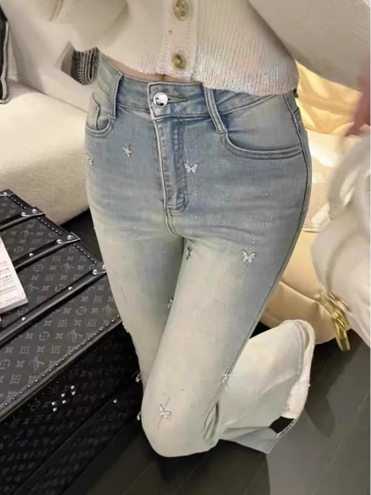 Style européen léger luxe lourd embelli diamant 2025 automne hiver taille haute jean évasé pour les femmes ajustement élastique pantalons longs