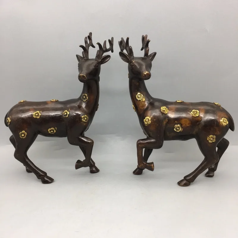 A pair of copper deer ornaments in a new Chinese style for home living room and entrance decoration, featuring plum blossom deer