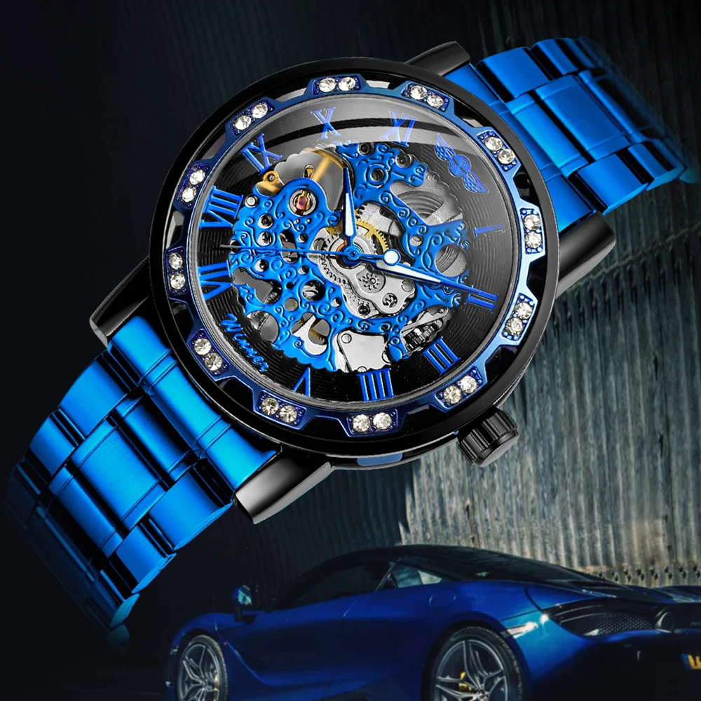 T-WINNER แฟชั่นลำลองบุรุษนาฬิกาโครงกระดูกกลไกตัวชี้ส่องสว่างแกะสลักหรูหราไรน์สโตนคูลสตีลแมนนาฬิกาข้อมือ