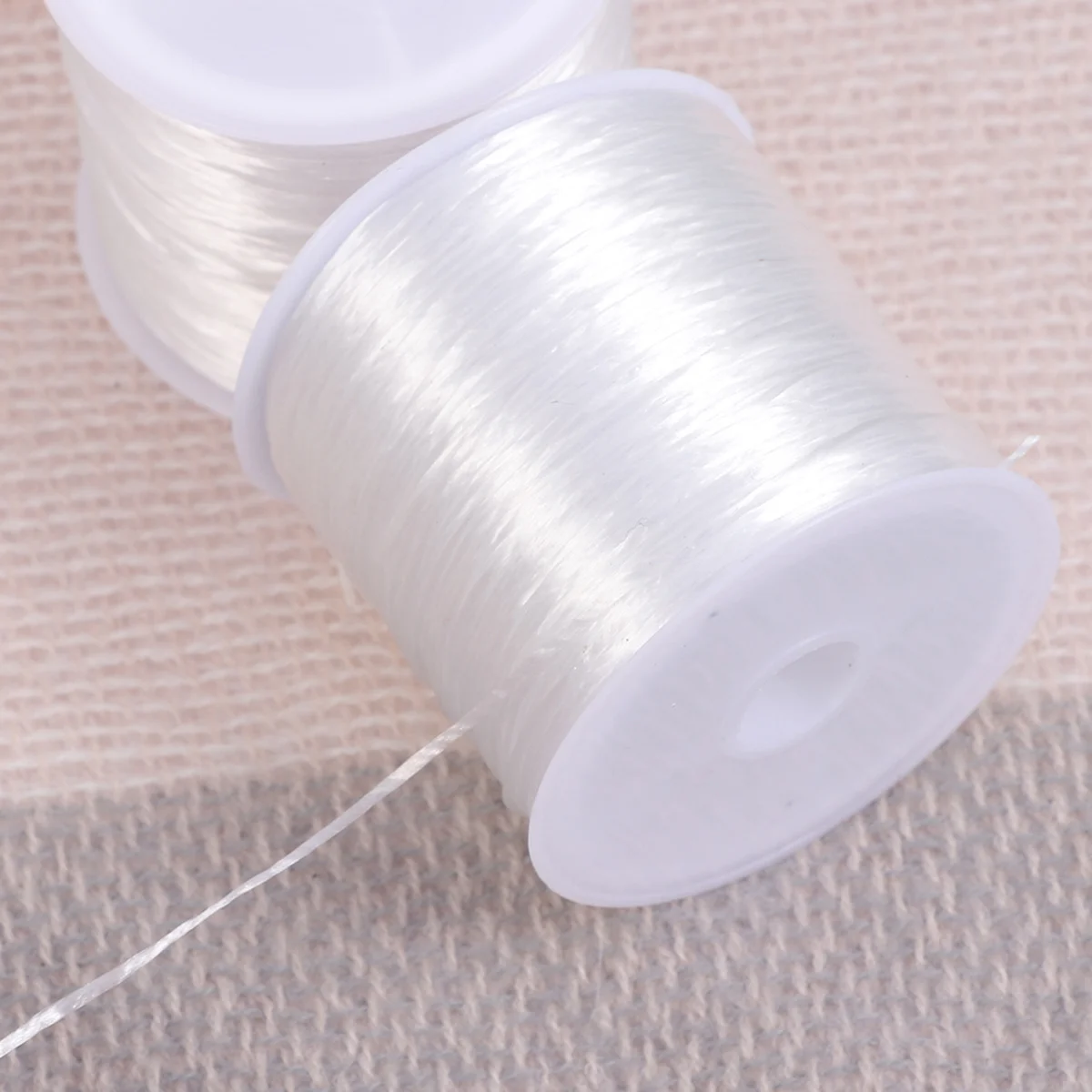 ジュエリー作り用の白い0.8mm 60mの伸縮性のある糸、ネックレス、ブレスレット、ビーズ織り、滑らかで使いやすいTPU素材