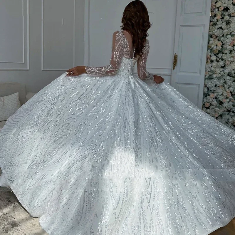 Lussuoso abito da sposa da donna bianco a trapezio in pizzo con perline 2026 Abito da sposa sexy con colletto trasparente a maniche lunghe personalizzato