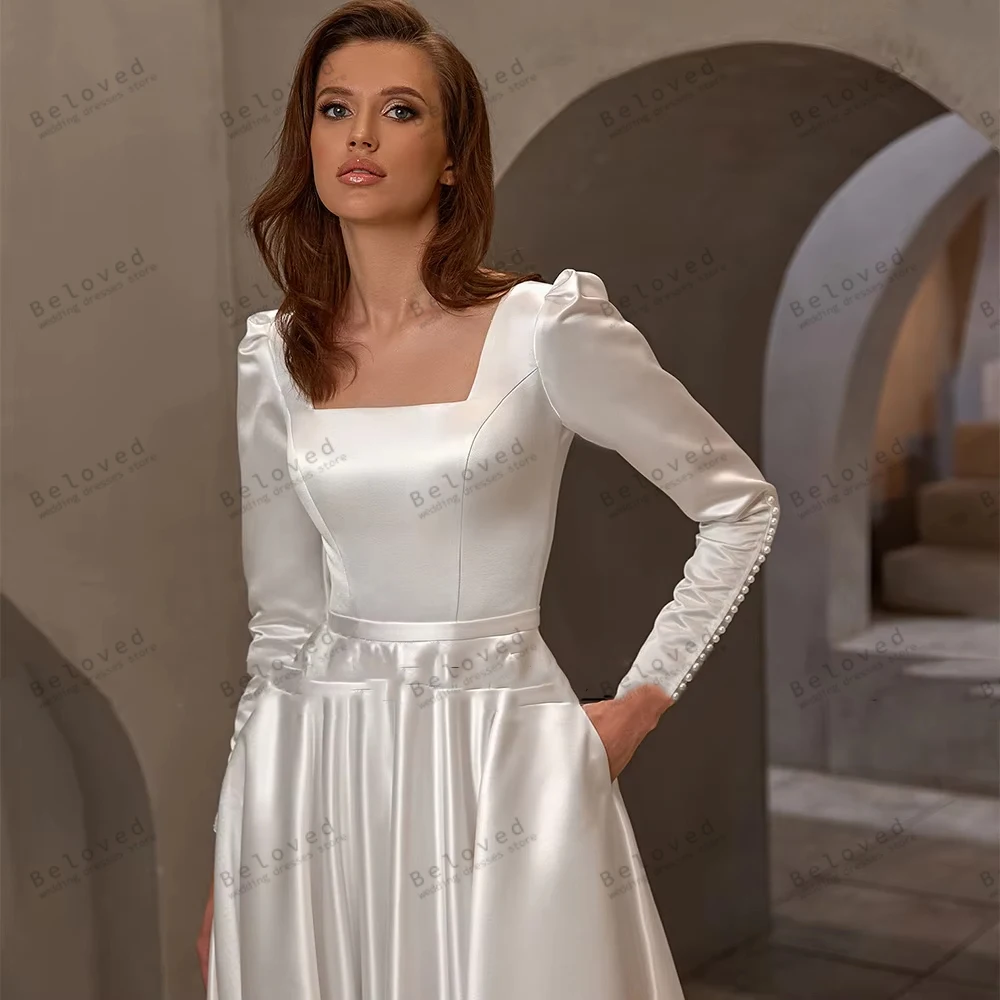 ชุดแต่งงานผ้าซาตินเรียบง่ายทรงเอไลน์ แขนยาว คอเหลี่ยม ดีไซน์สวยงาม  รับตัดตามสั่ง ปี 2026