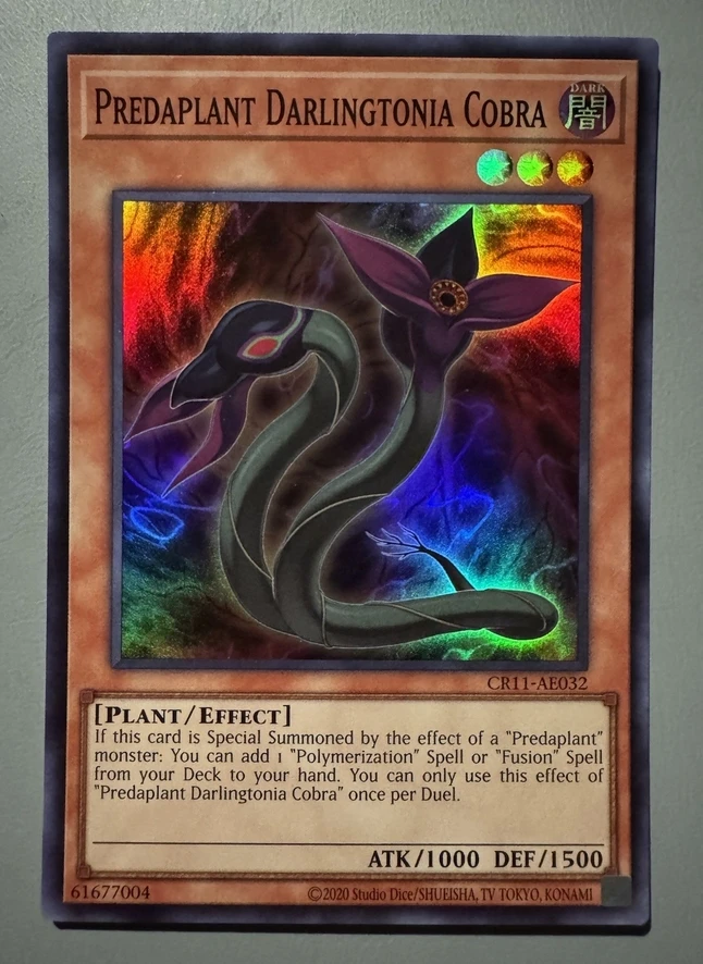 

Yugioh KONAMI Duel Monsters CR11-AE032 Predaplant Darlingtonia Cobra Super Rare Asian English Collection Mint Card