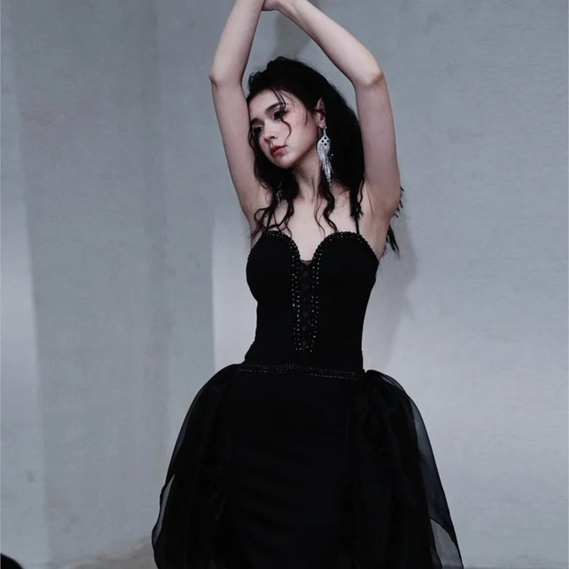 Dark style halter design with a flowing ribbon mini dress