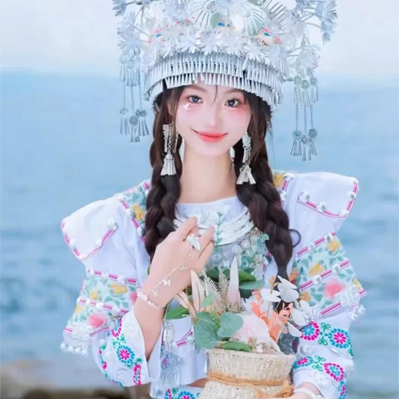 

Young girl clothing white small embroidery top long skirt streamer photo trip