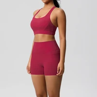 Women’s red sports bra and matching high-waisted fitness shorts set
