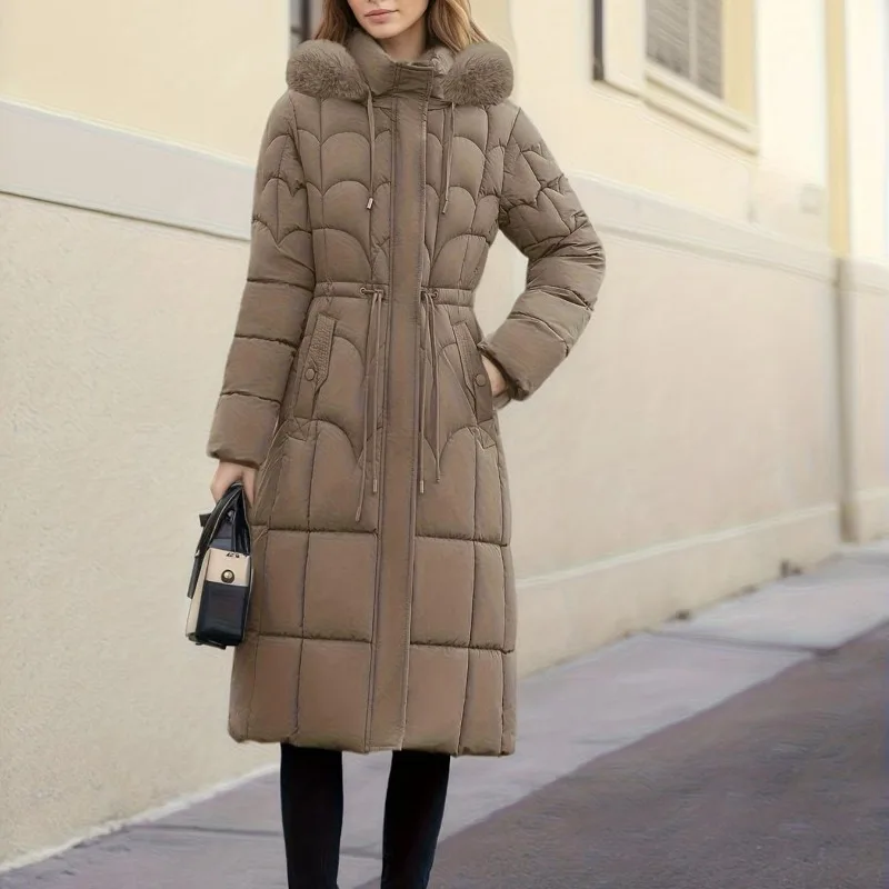 New fashionable women's clothing for autumn and winter. A stylish long, warm cotton-padded jacket with a fur collar and hood.