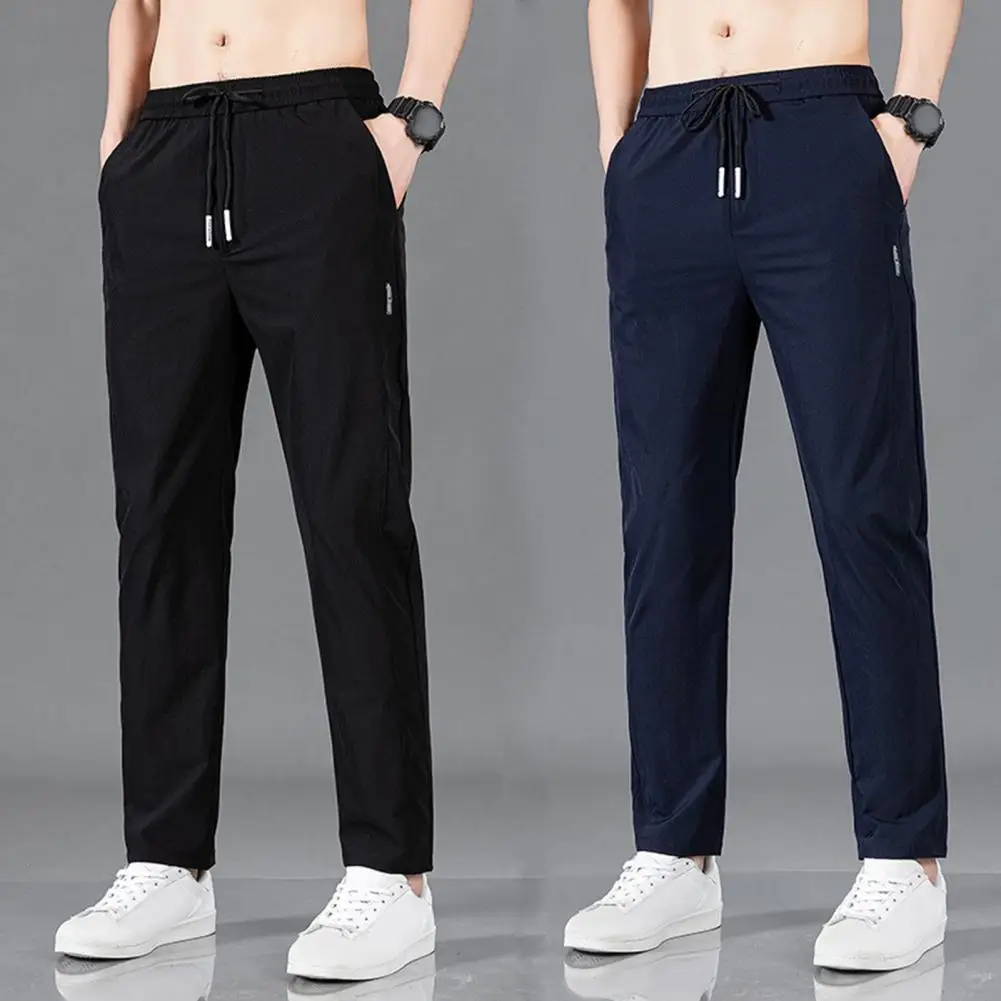 Celana olahraga pria, celana kasual pria Ice Silk 2024, warna Solid, celana Sweatpants kaki lurus bersirkulasi elastis luar ruangan
