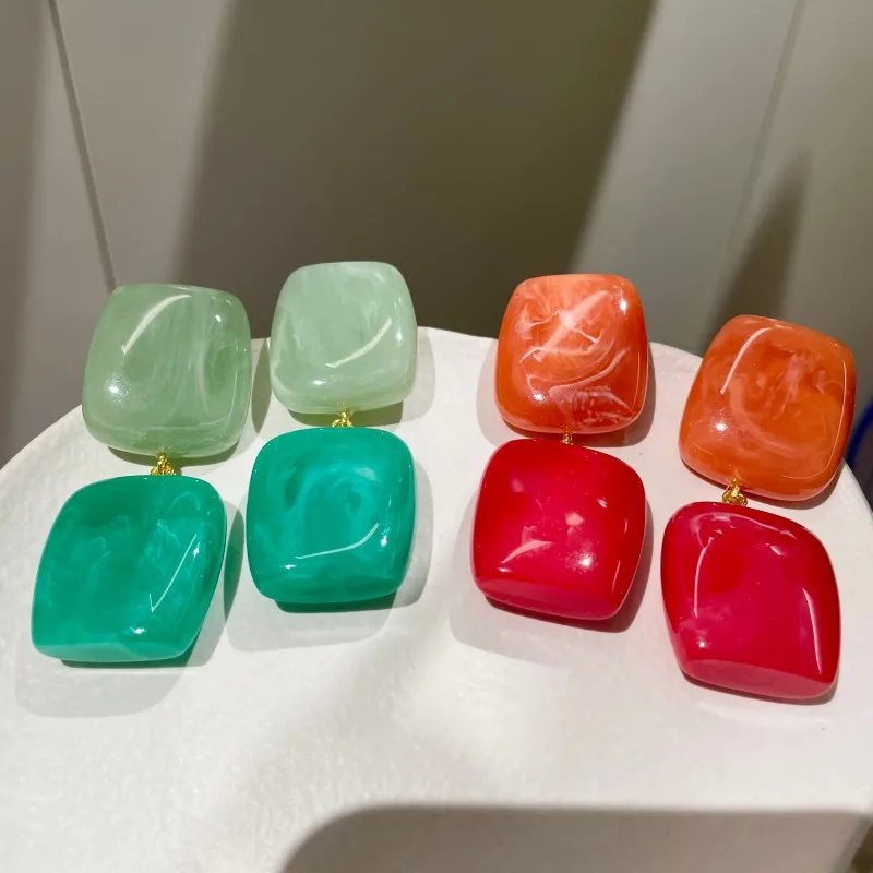 Blue, green, red and orange contrasting three-dimensional resin pendant earrings