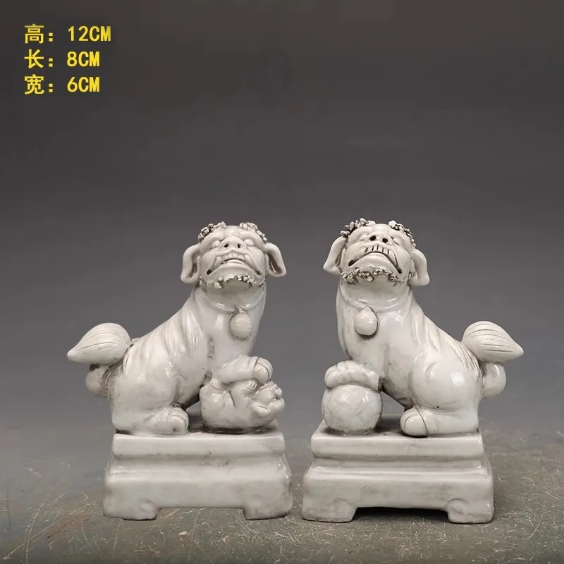 A pair of white porcelain lions playing with a ball from the Mingdehua kiln culpture porcelain Statue