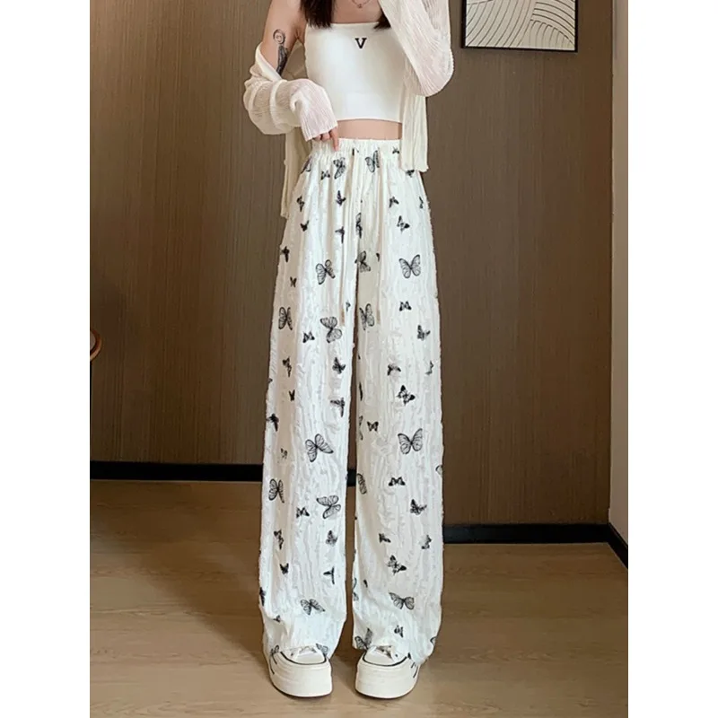 Nuovi pantaloni a gamba larga a farfalla in stile cinese Pantaloni a gamba dritta bianchi larghi e pigri a vita alta di nuovo stile estivo femminile con fori