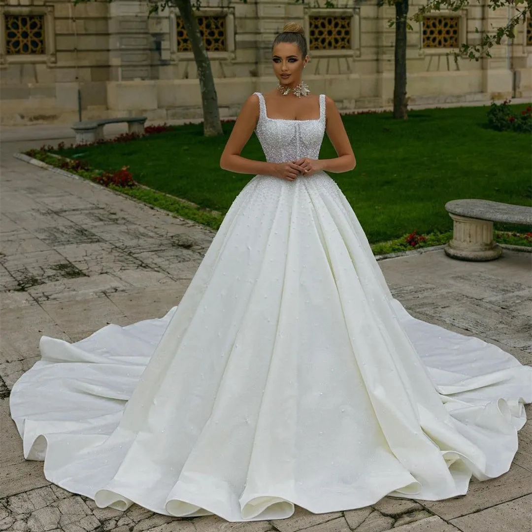 

Luxury Ball Gown Wedding Dresses Sleeveless Bateau Straps Sequins Appliques Beaded Ruffles Pearls Bridal Gowns Vestina De Novia