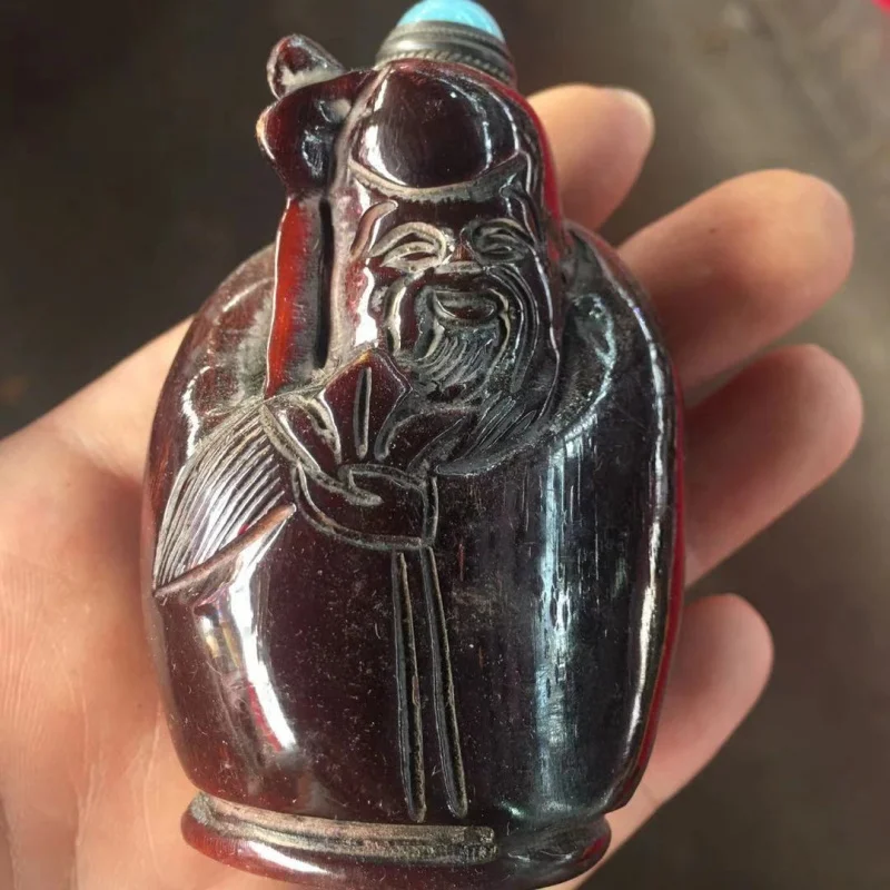 Antique Tibetan-Style Red Translucent Ox Horn Snuff Bottle  Different carved patterns, randomly distributed