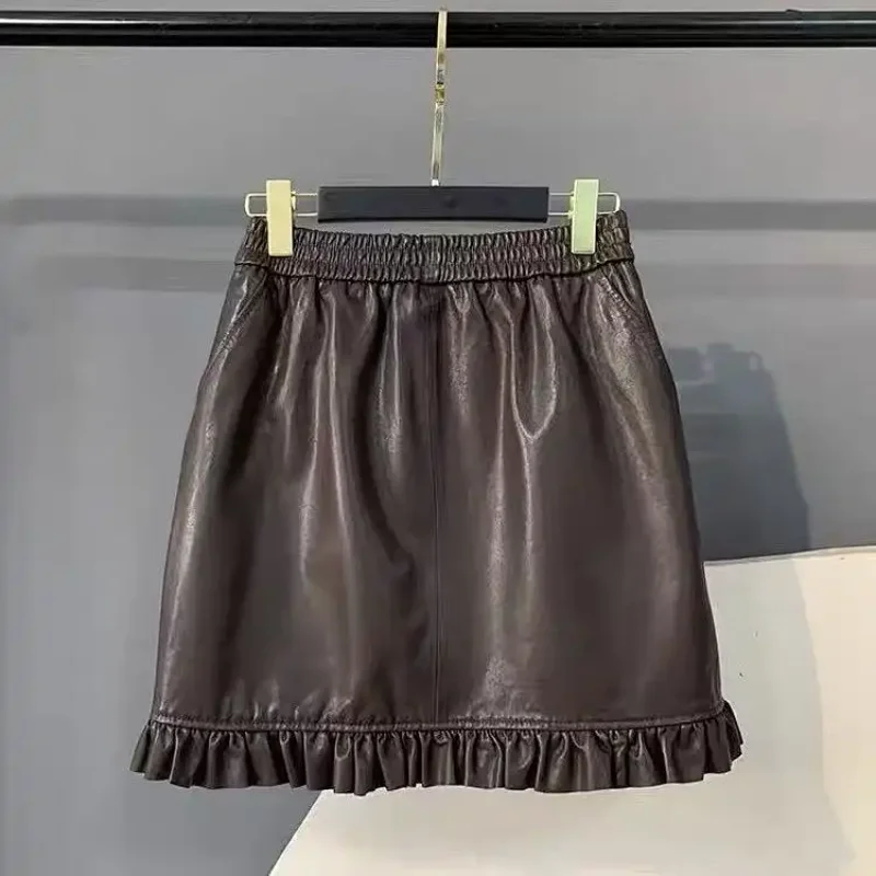 กระโปรงหนัง PU ทรงเอ สไตล์มินิ สำหรับผู้หญิง รุ่นใหม่ประจำฤดูใบไม้ผลิ เอวสูง ทรงหลวม ชายกระโปรงทรงสวยทันสมัย  กระโปรงทรงเอ  กระโปรงยอดนิยม