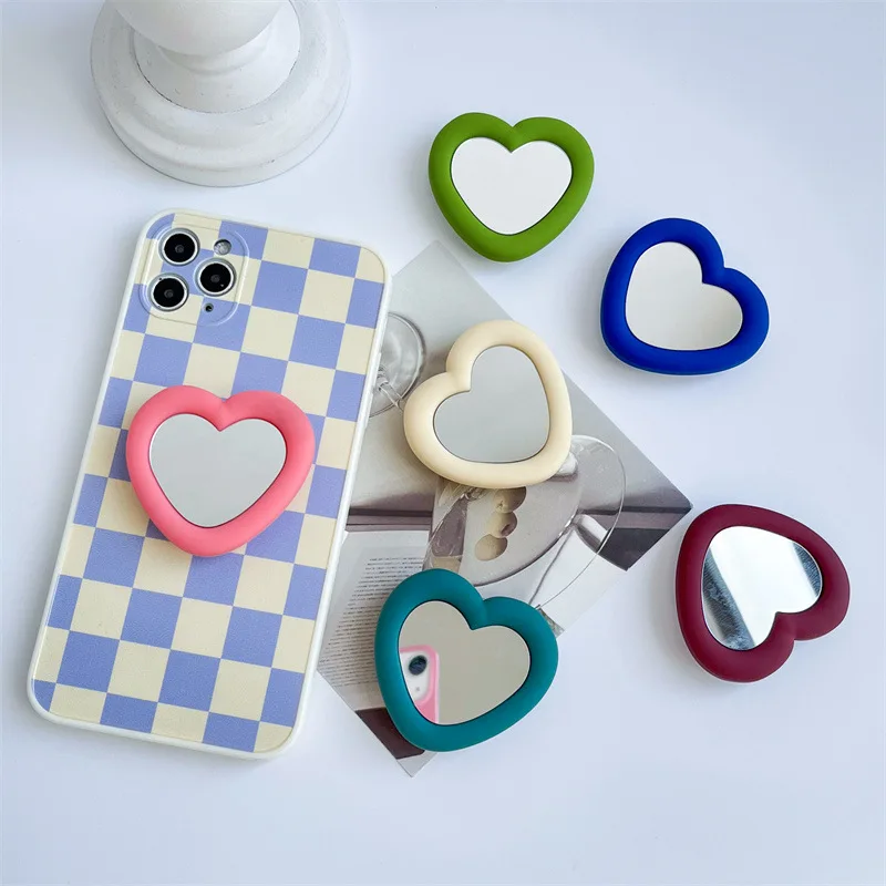 

Креативное силиконовое зеркало для макияжа в форме сердца, крепление на подушку безопасности, встроенный кольцевой держатель, прозрачная задняя часть, поддержка настольного телефона