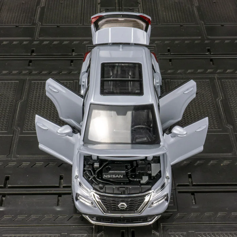 Modelo de vehículo todoterreno de aleación Nissan x-trail 1:32, puerta de juguete para niño extraíble y el maletero del capó se puede abrir como regalo
