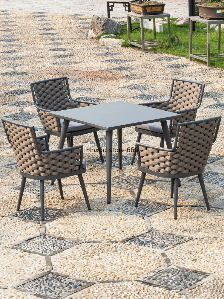 

Nordic rattan courtyard waterproof and sunscreen tables and chairs