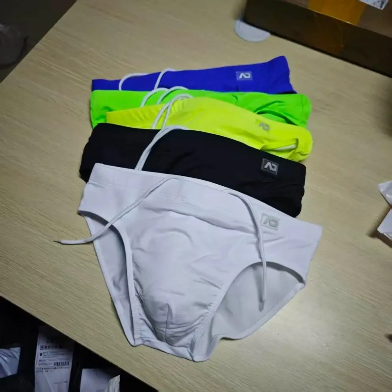 

2026 seaside beach surfing solid color simple classic men's low-rise swimming trunks wholesale multicolor BS420