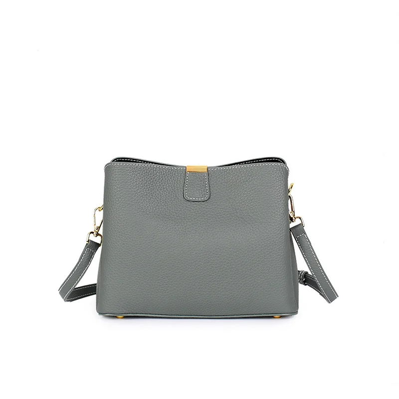 The 2026 new top-grain cowhide bucket bag for women is a versatile commuter leather design. It is a trendy and luxurious handbag