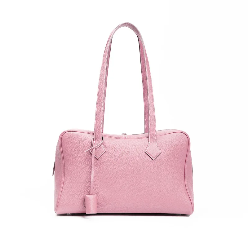 

Plush TC leather Victoria bag. This chic, slouchy "pillow" design adds vintage luxury to your daily commute.