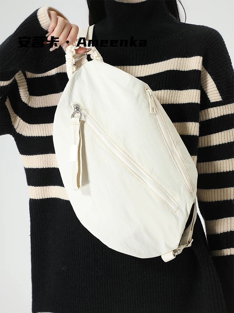 

2025 оригинальная женская сумка неправильной формы с диагональным крестом, водонепроницаемая нейлоновая ткань, простые повседневные универсальные дорожные рюкзаки, модные