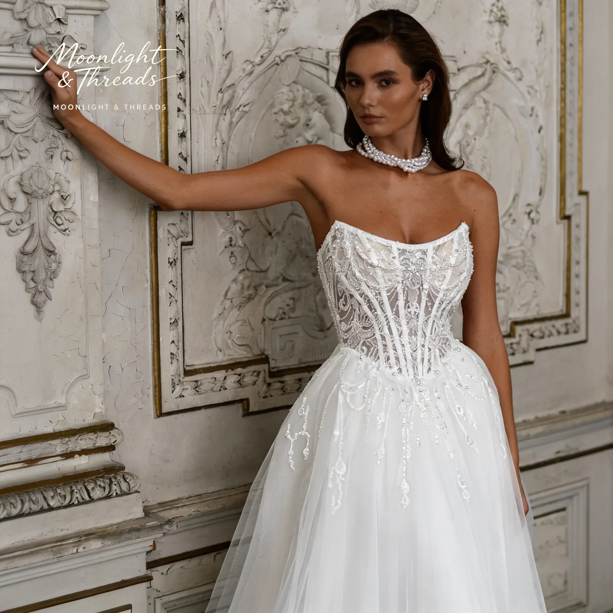

White strapless sleeveless floor-length ball gown for formal weddings featuring embroidery and a boned corset bodice