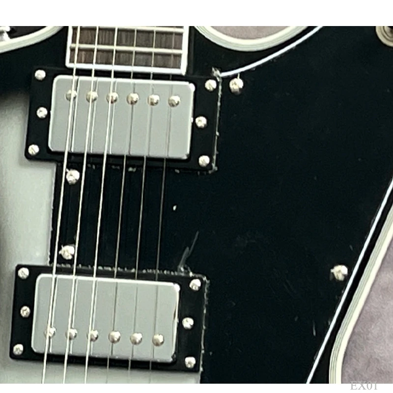 angular offset shape right handed solid body electric guitar, silver burst finish, hh humbucker pickups