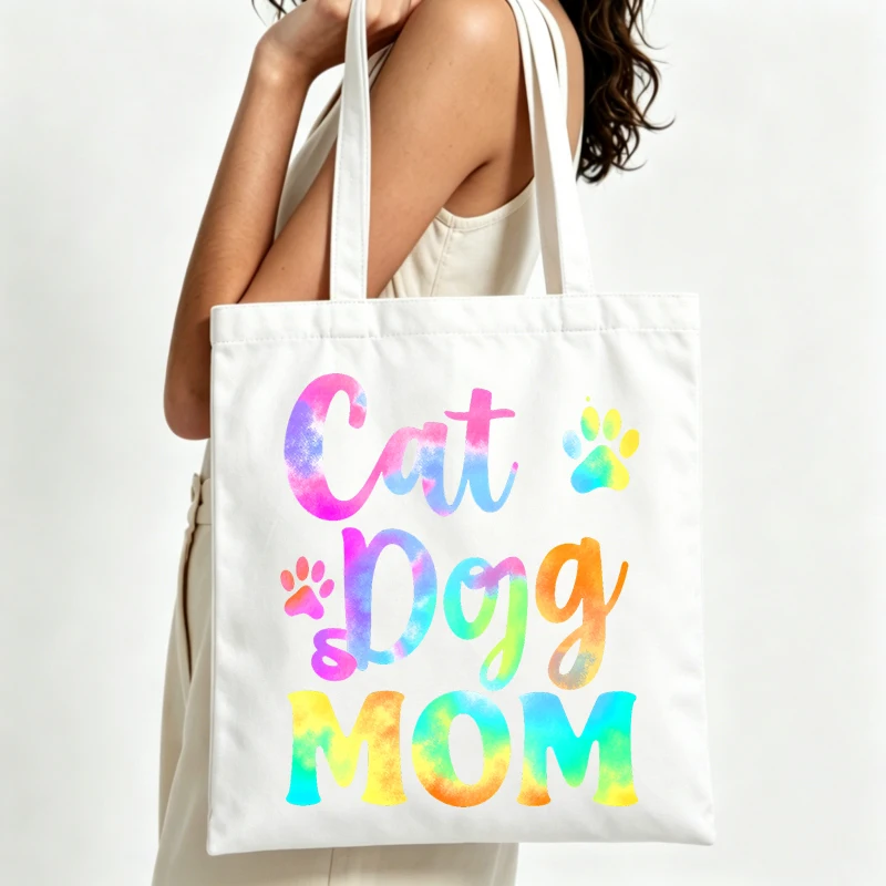 cat dog mom letter print canvas tote bag with paw graphics, perfect for daily shopping and casual outings