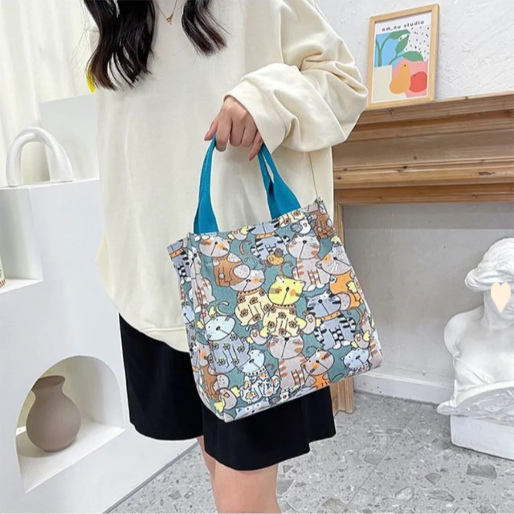 Borsa da pranzo con stampa di cartoni animati carini, borsa di tela portatile, borsa Casual da donna e borsa Tote per scuola, ufficio, borsa da