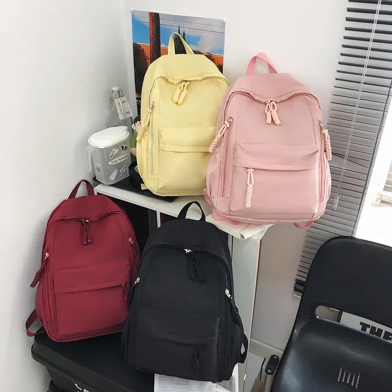 Bolsa de escola de nylon simples com zíper sólido de alta capacidade Mochilas de moda para meninos e meninas, linha de costura, 2024